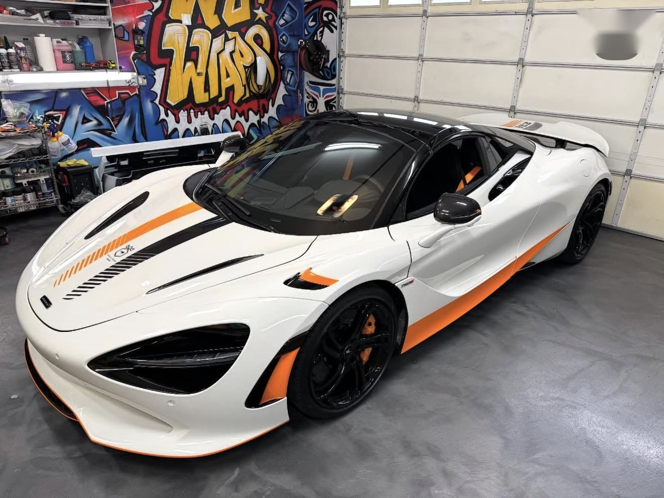 White McLaren 750S Spyder Triple Crown with orange accents inside the Wu Wraps studio
